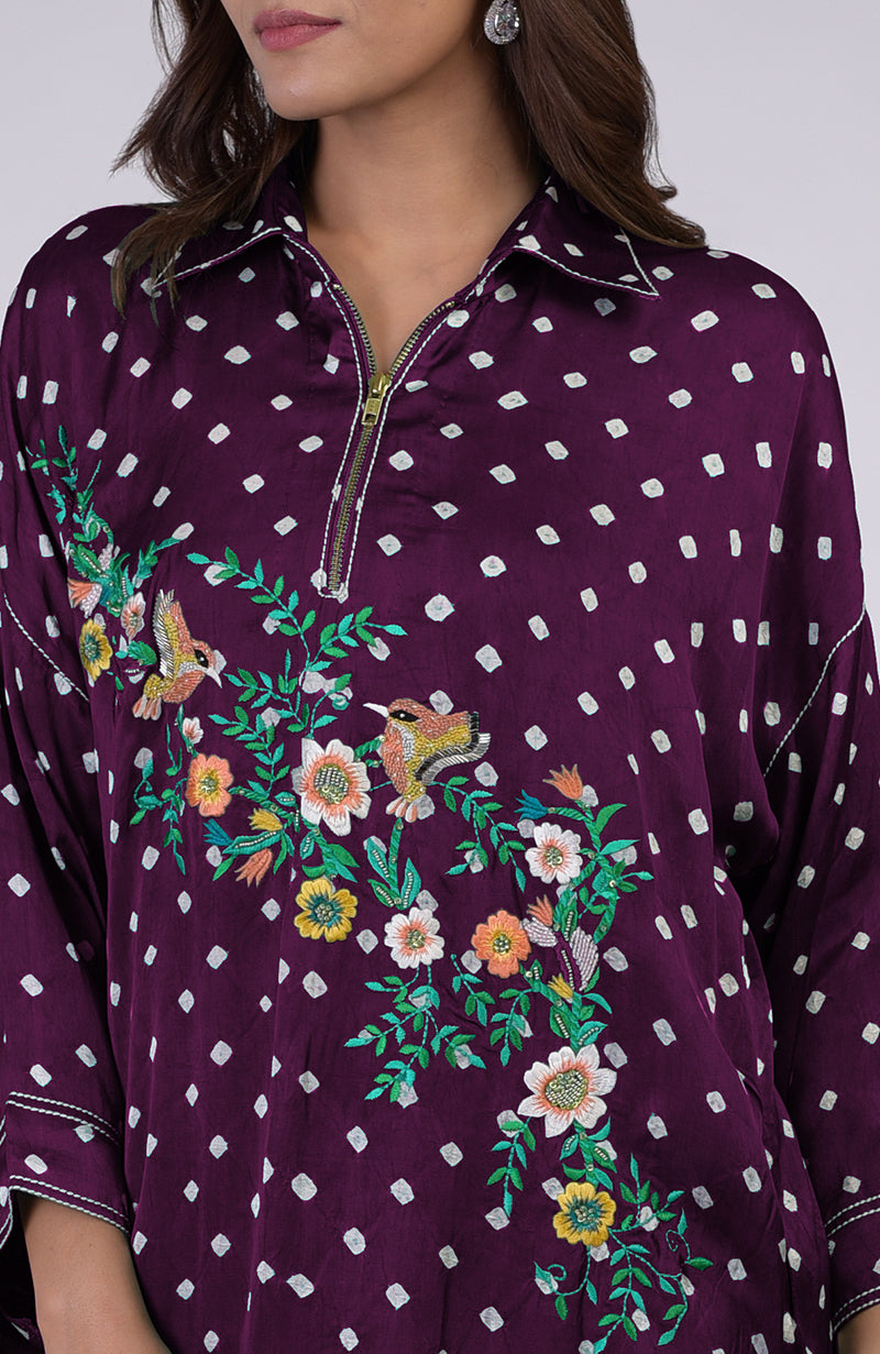 Plum bandhej co-ord set with multi-color embroidery and a zipper neckline.
