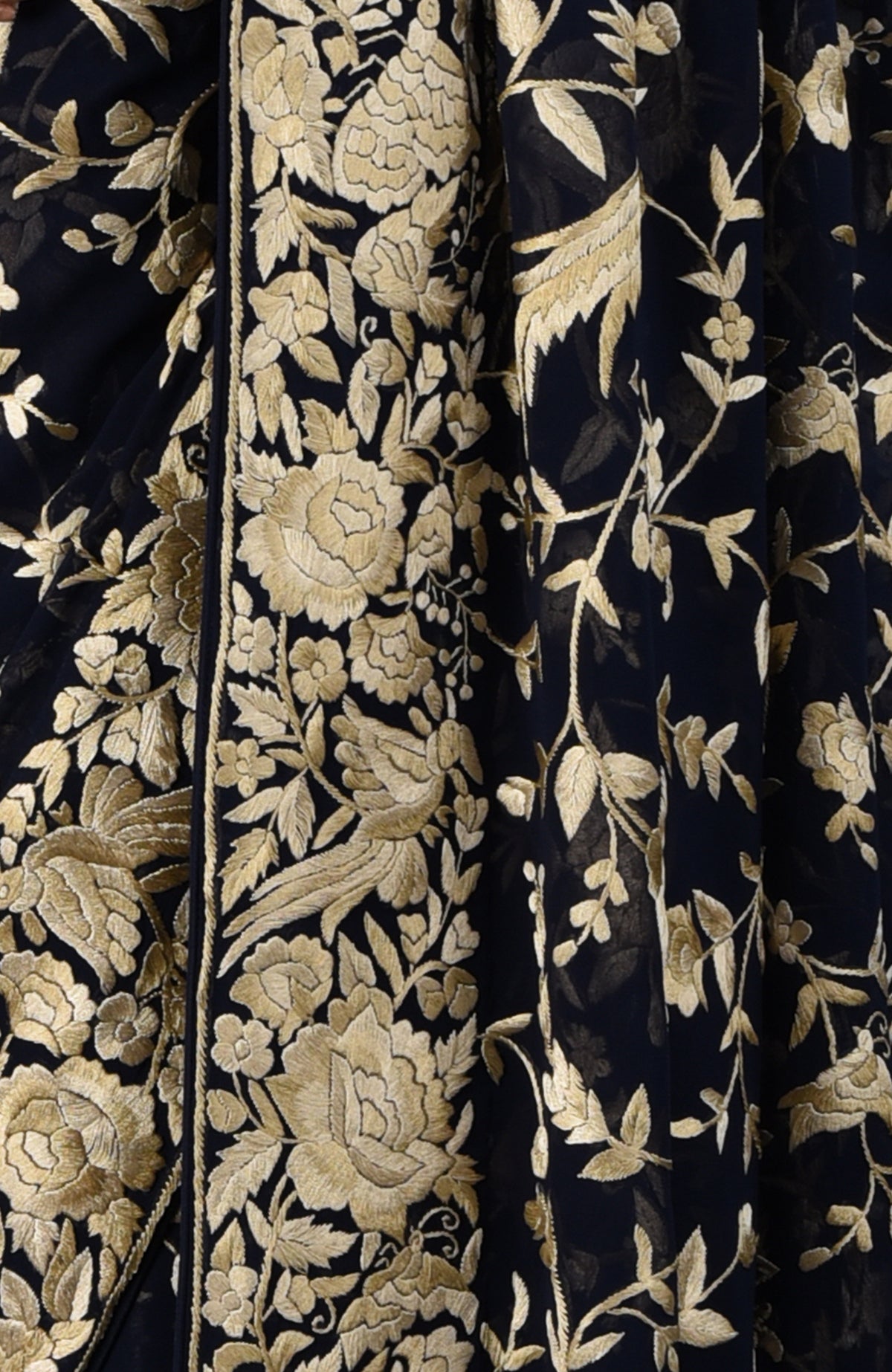 Midnight blue Parsi Gara hand-embroidered saree with gold floral and bird motifs.