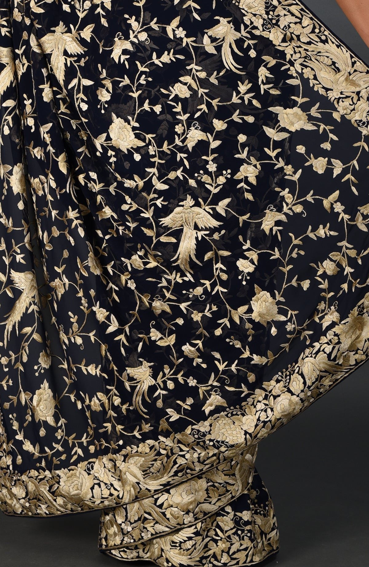 Midnight blue Parsi Gara hand-embroidered saree with gold birds and floral patterns.