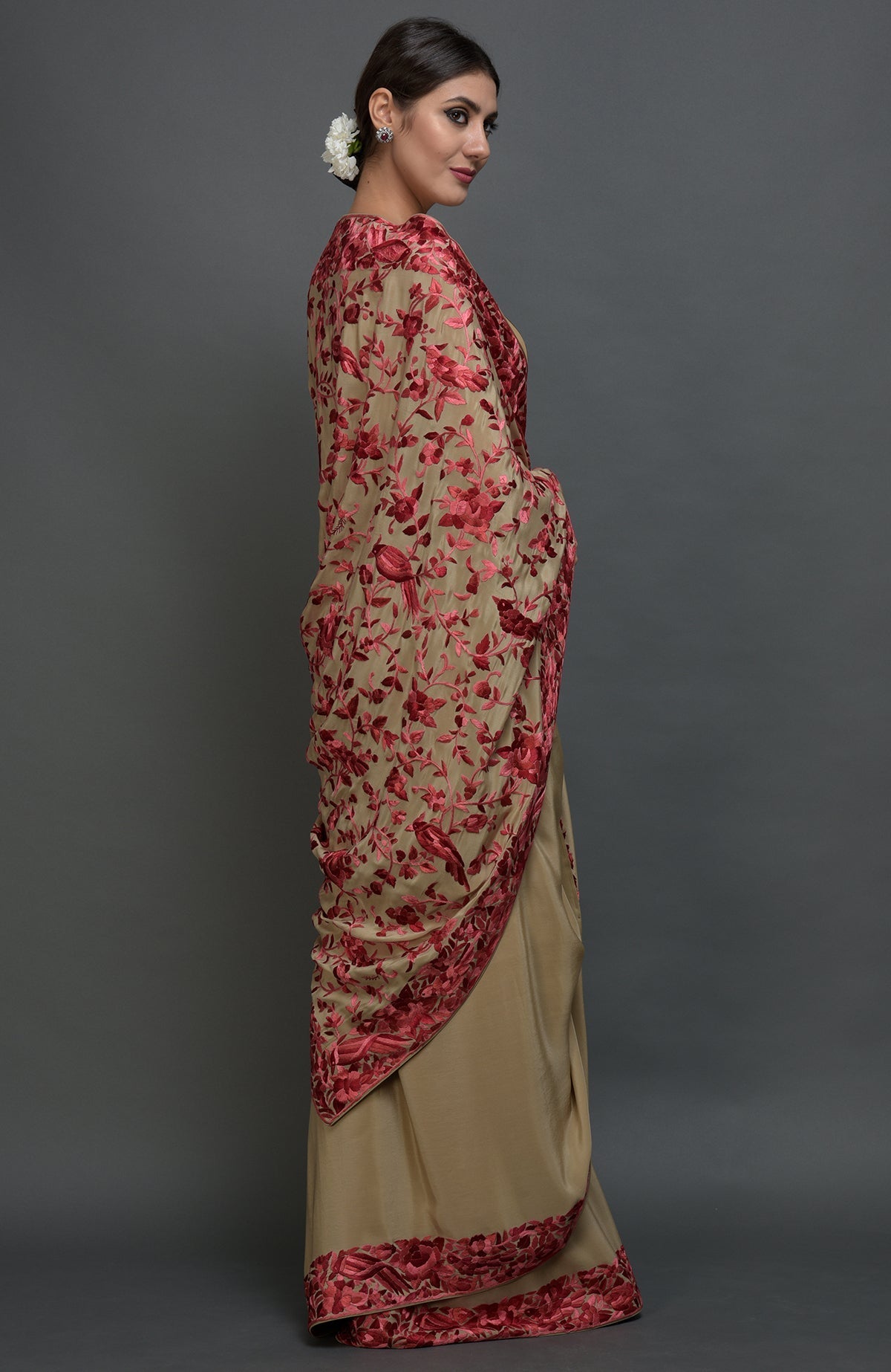 Beige Parsi Gara hand-embroidered saree with floral and bird motifs.