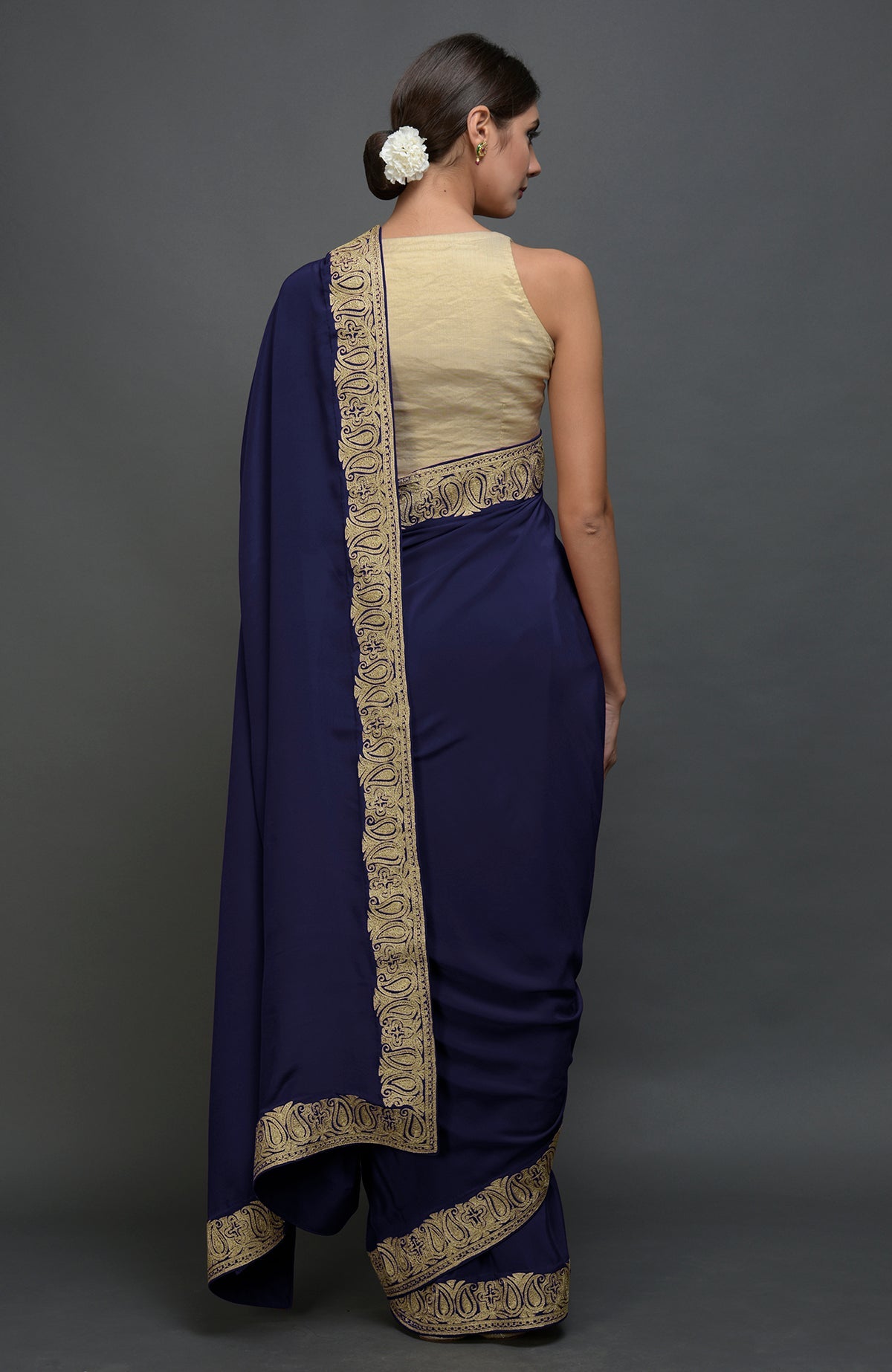 Navy blue pure crepe saree with gold paisley tilla aari embroidery.
