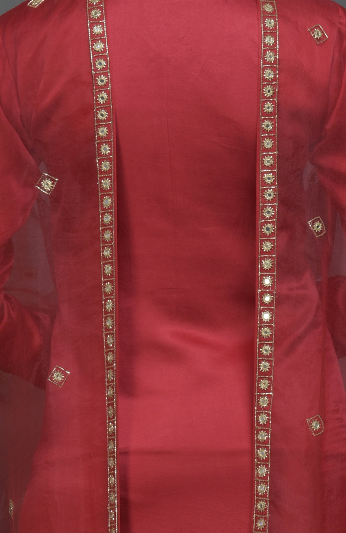 Red suit with gold mirror and zardozi work on the front and dupatta.