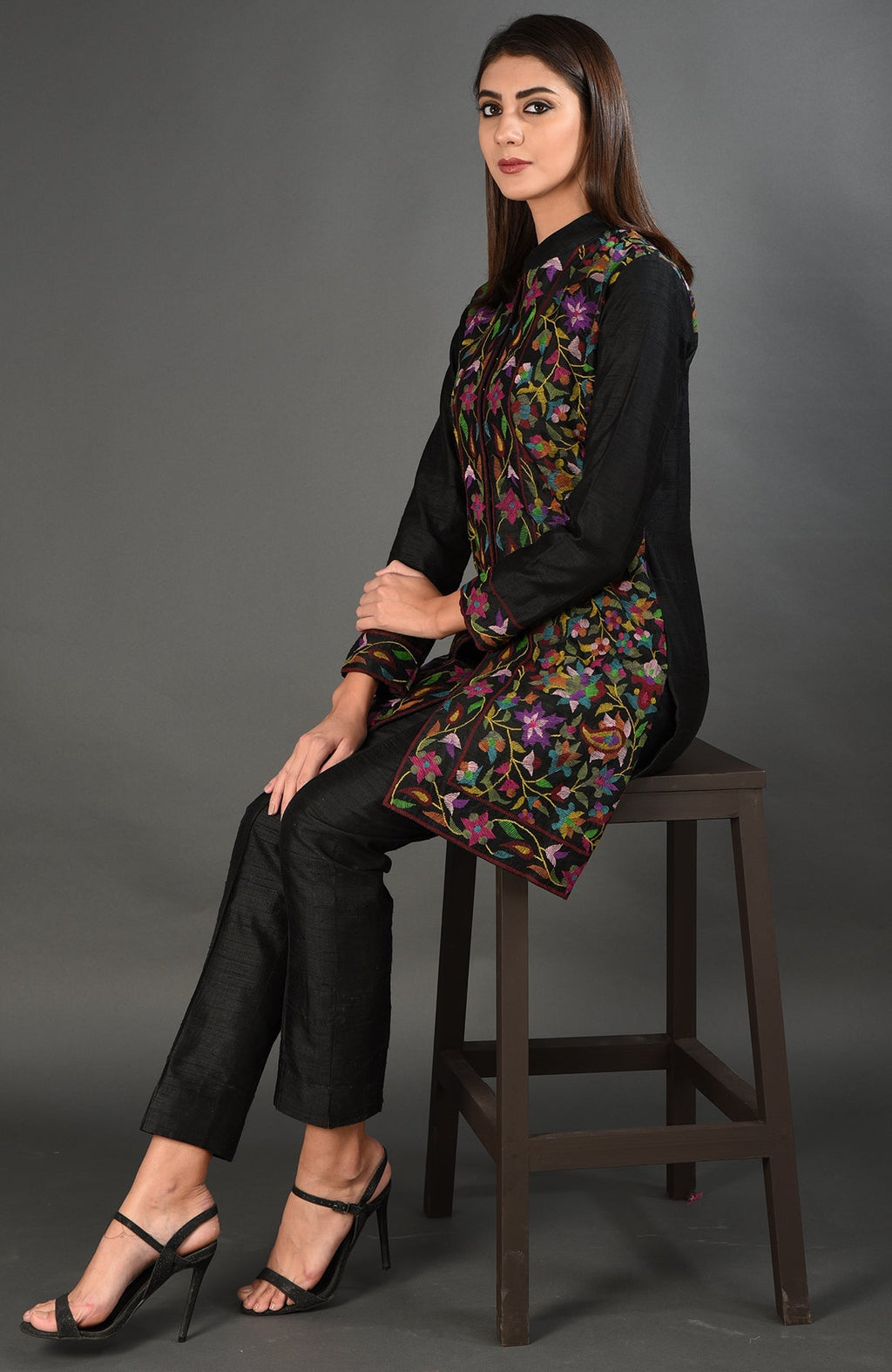 Black Kashmir Kani Art embroidered jacket with colorful floral patterns.