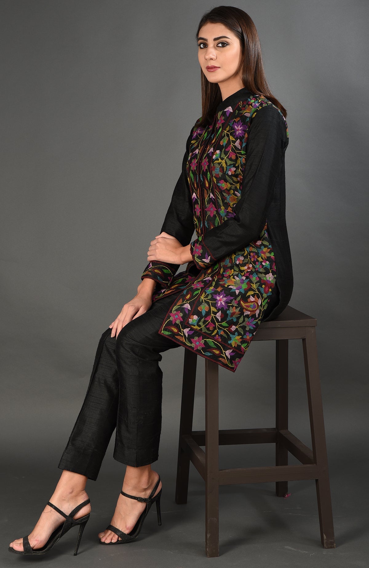 Black Kashmir Kani Art embroidered jacket with colorful floral patterns.