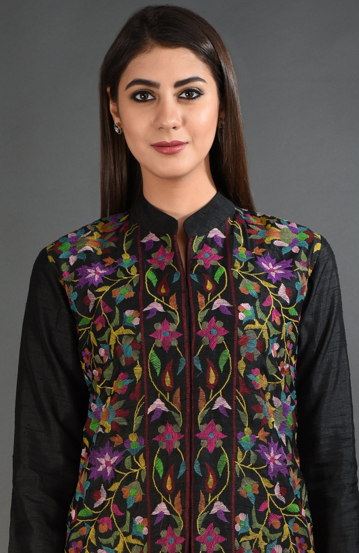 Black raw silk jacket with colorful floral Kani art embroidery.