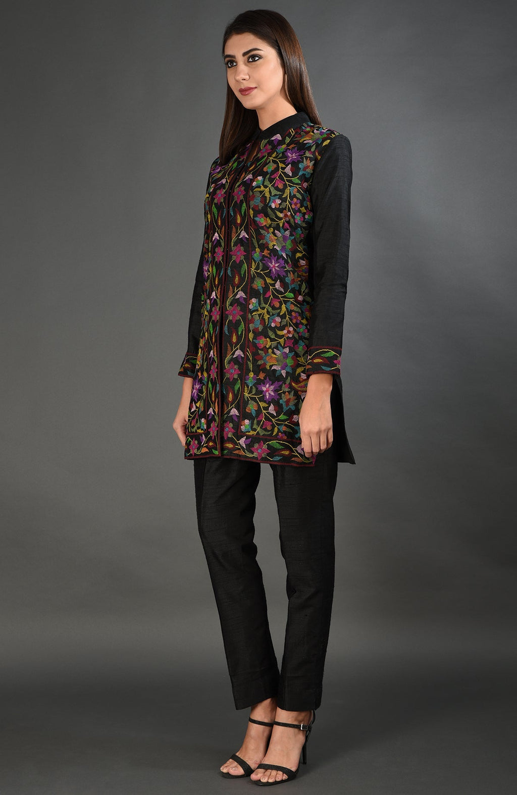 Black Kashmir Kani Art embroidered jacket set with a woman modeling it.