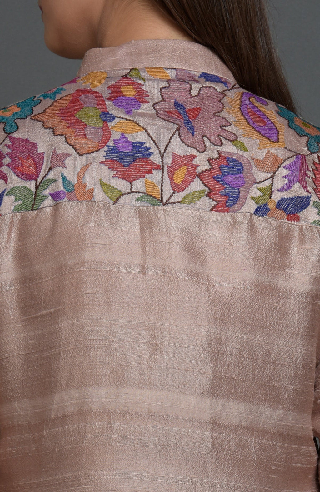 Rosy brown raw silk jacket with colorful floral Kani art embroidery on the back yoke.