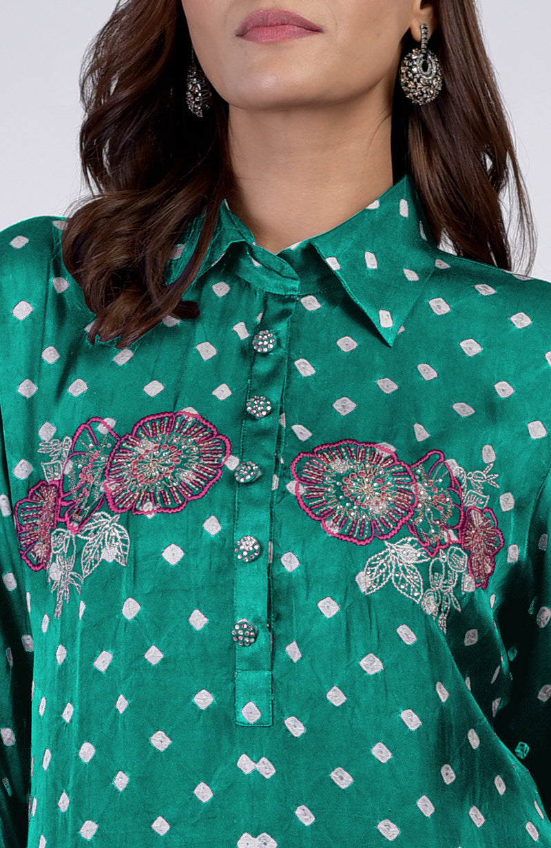 Emerald green bandhej co-ord set with floral silk thread embroidery and embellished buttons.