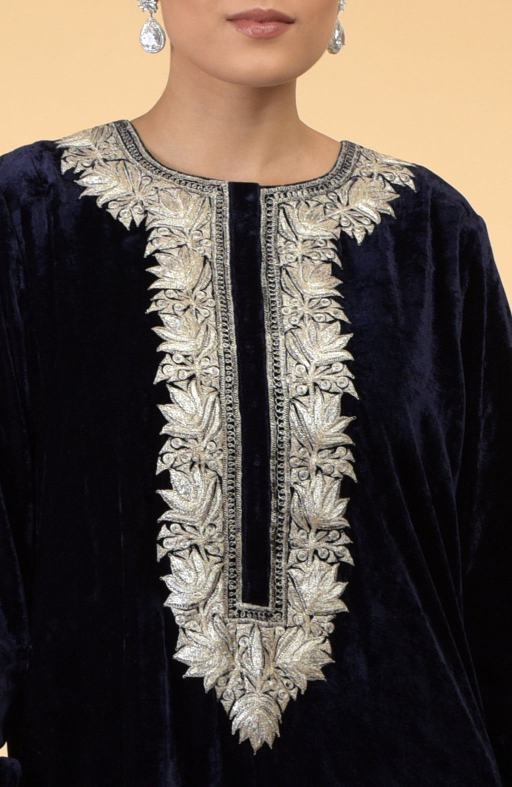 Midnight blue velvet kaftan with silver Kashmir-inspired embroidery around the neckline.
