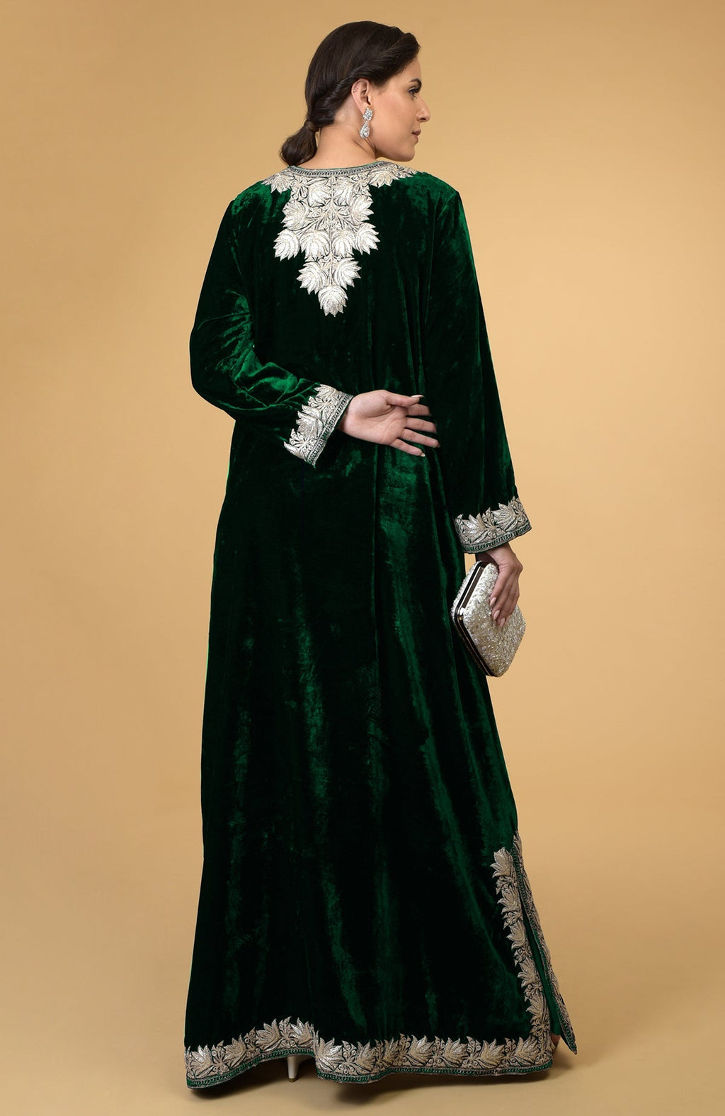 Emerald green velvet kaftan with silver Kashmir embroidery, shown from the back.