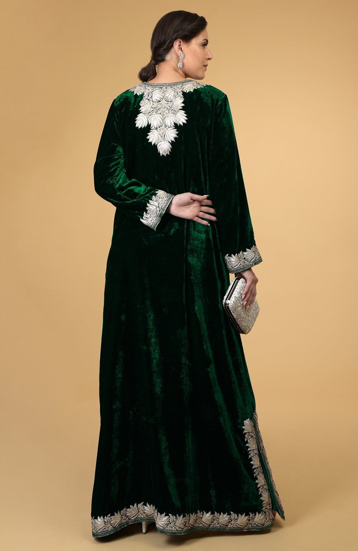 Emerald green velvet kaftan with silver Kashmir embroidery, shown from the back.