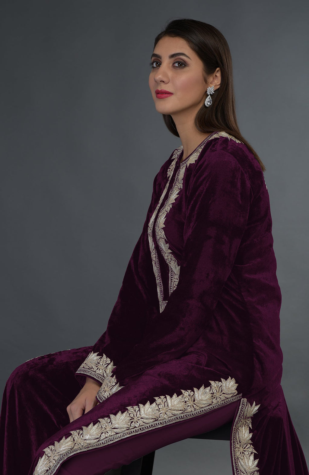 Plum velvet suit with silver tilla embroidery, worn by a woman.