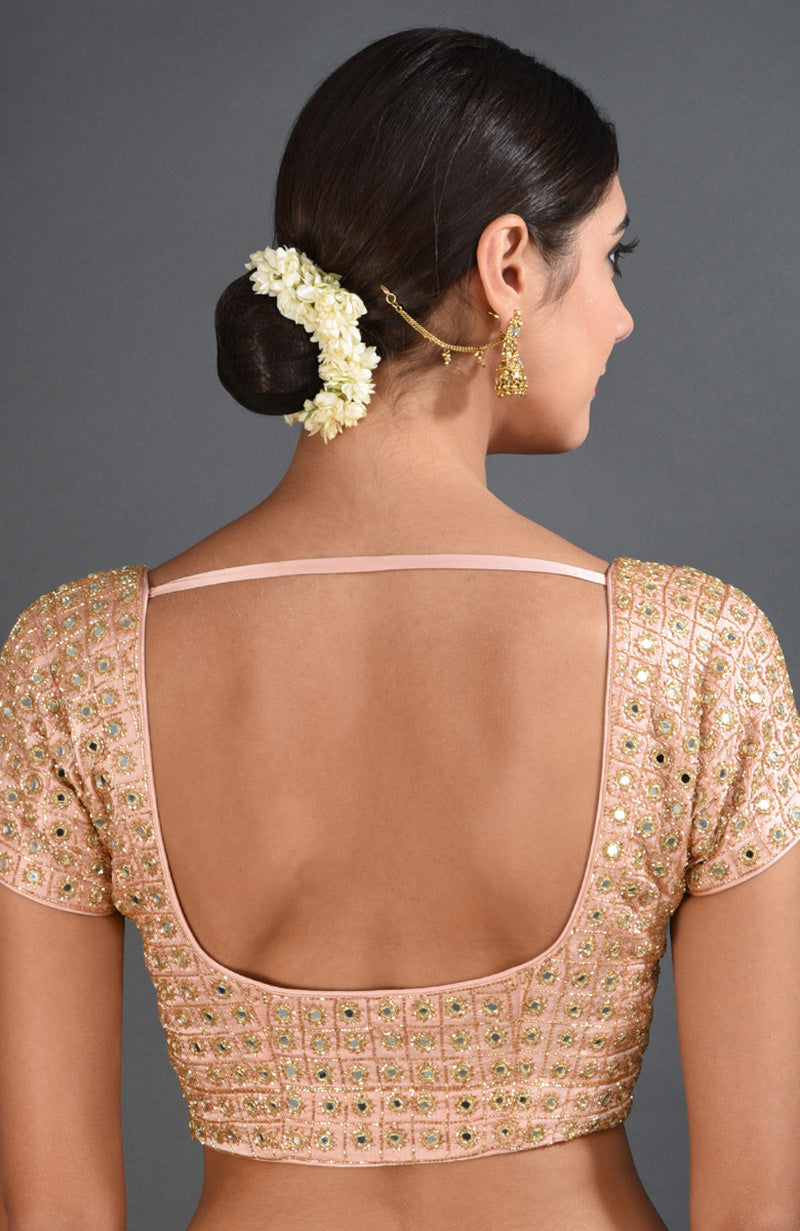 Pearl pink mirror and zardozi hand-embroidered blouse with a deep back.