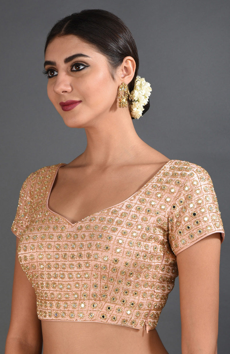 Pearl pink mirror and zardozi hand-embroidered blouse with cap sleeves.