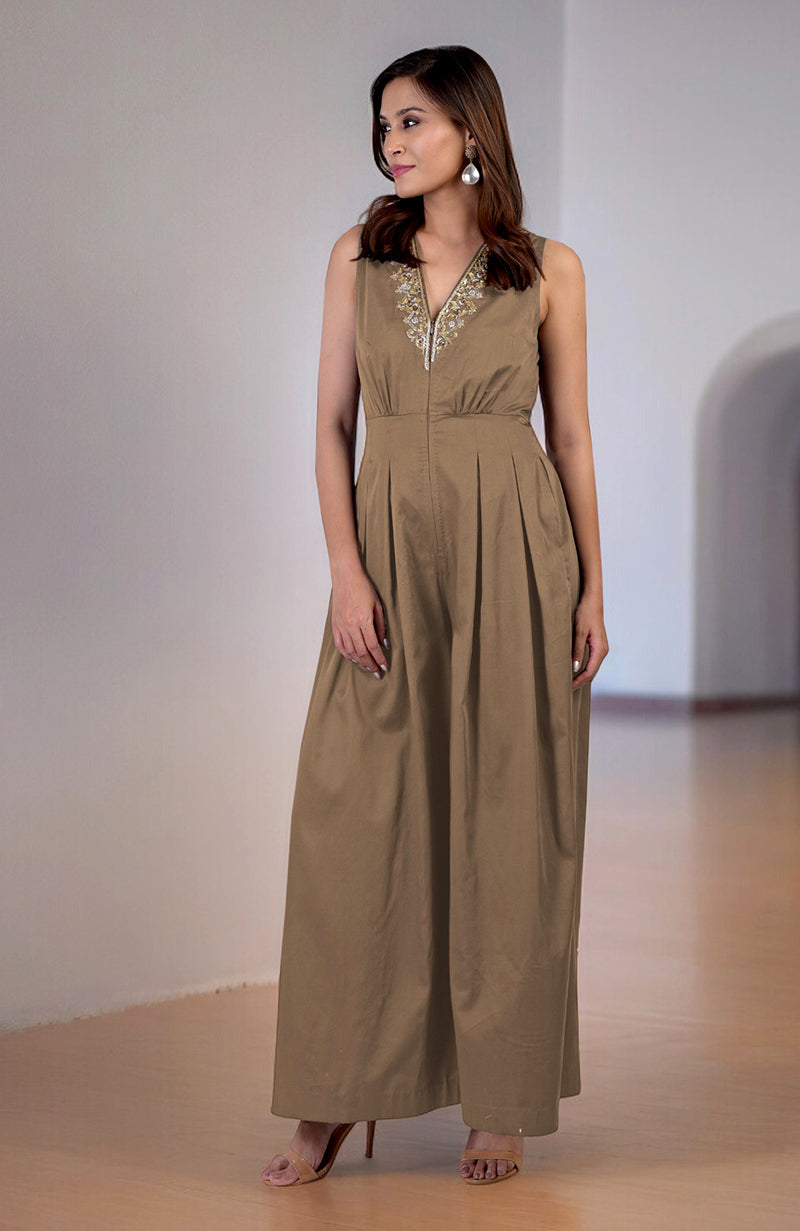Brownie gold tilla hand embroidered jumpsuit with a V-neckline and front pleats.
