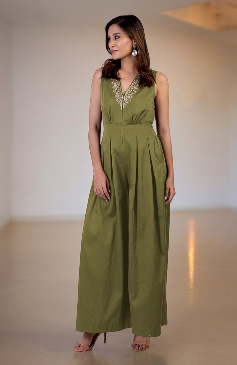 Green moss jumpsuit with gold tilla hand embroidery, V-neck, and front pleats.