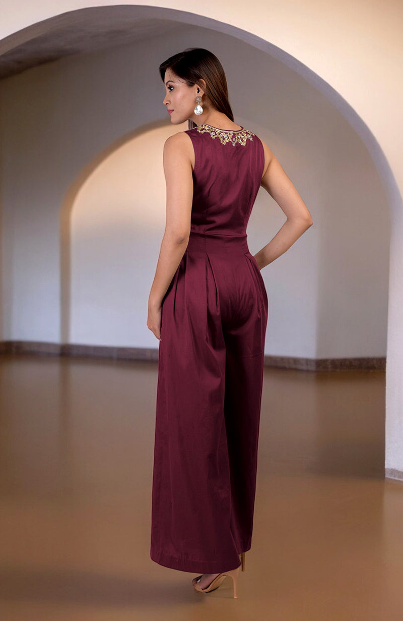Red plum jumpsuit with gold tilla hand embroidery on the back neckline.