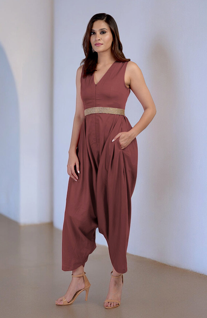 Marsala V-neck jumpsuit with a gold embroidered belt and side pockets.