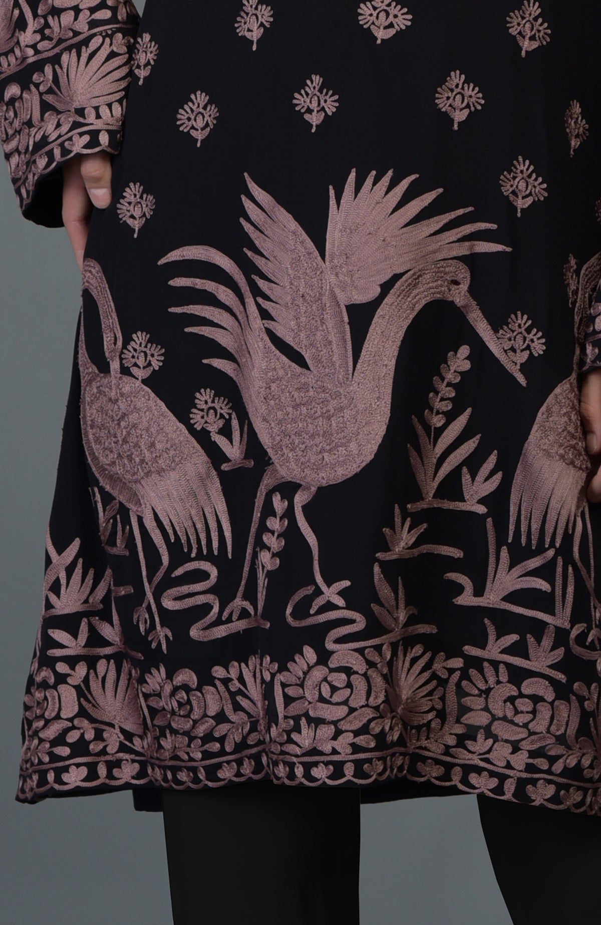 Black-mauve Parsi embroidered tunic suit with crane and floral motifs.