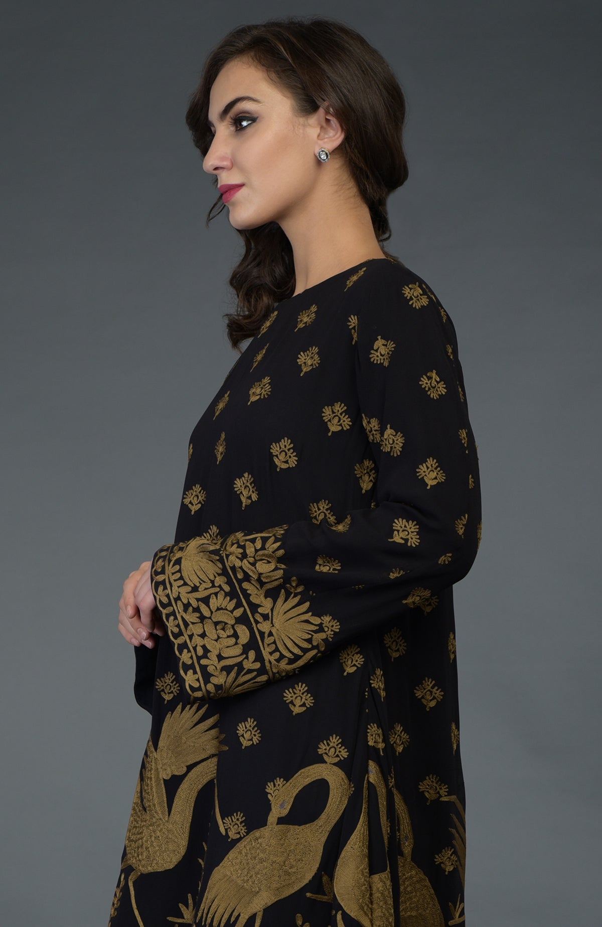 Black-beige gold Parsi embroidered tunic suit with crane and floral motifs.