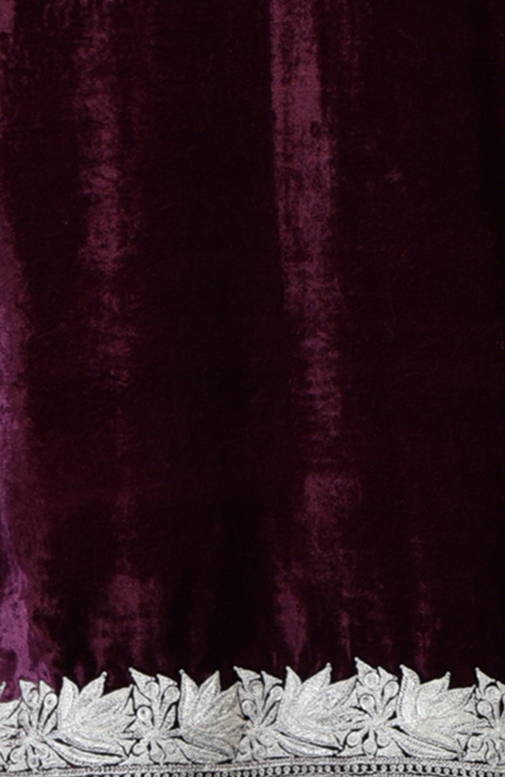 Dark plum velvet fabric with silver tilla floral embroidery along the bottom edge.