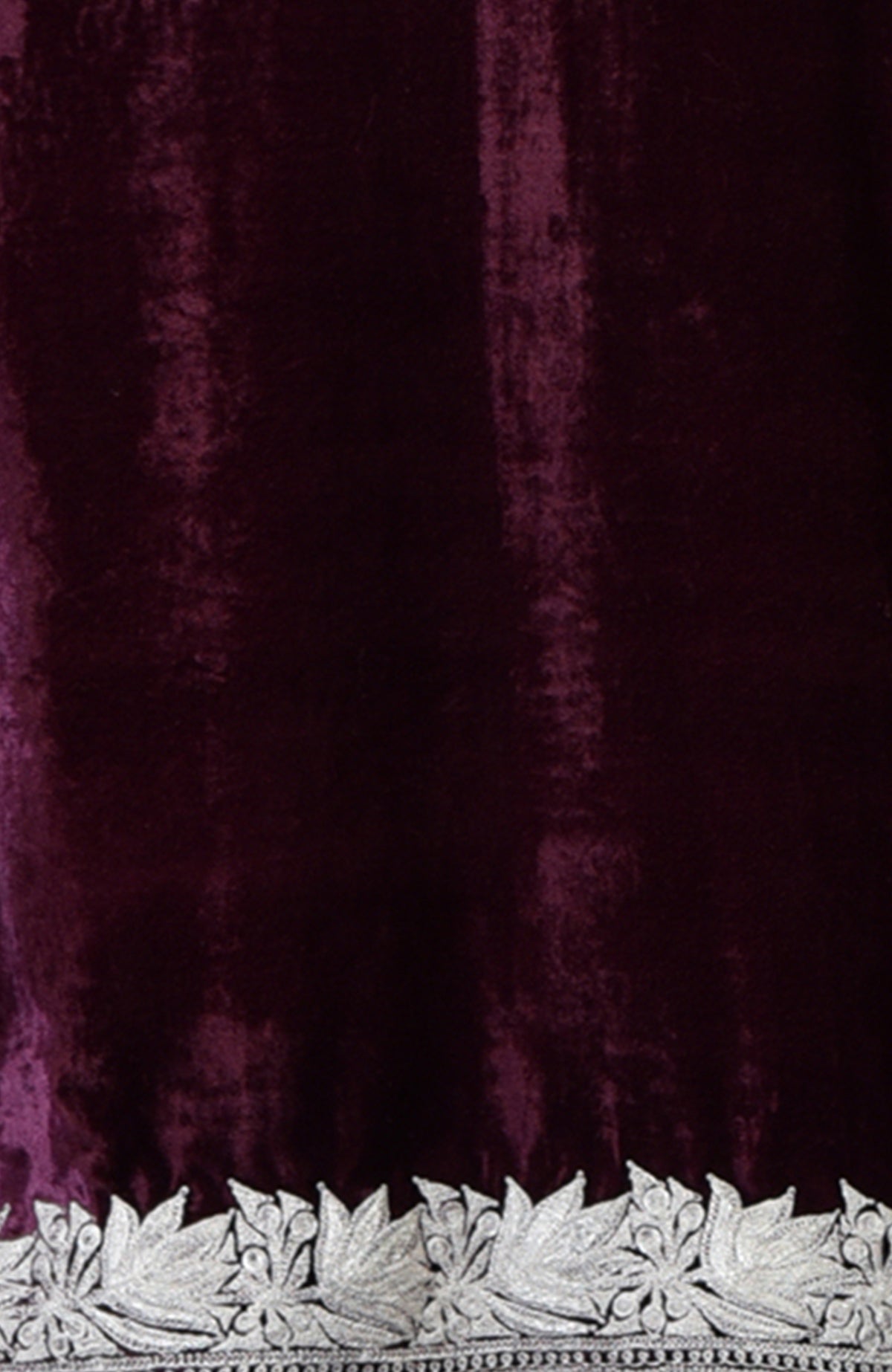 Dark plum velvet fabric with silver tilla floral embroidery along the bottom edge.