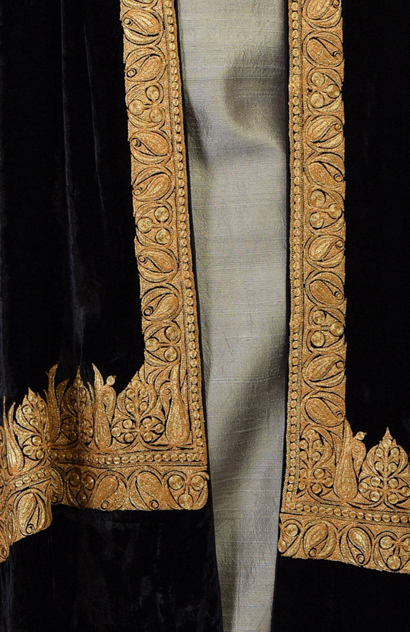 Black velvet dupatta with intricate gold Kashmiri tilla embroidery over a beige suit.