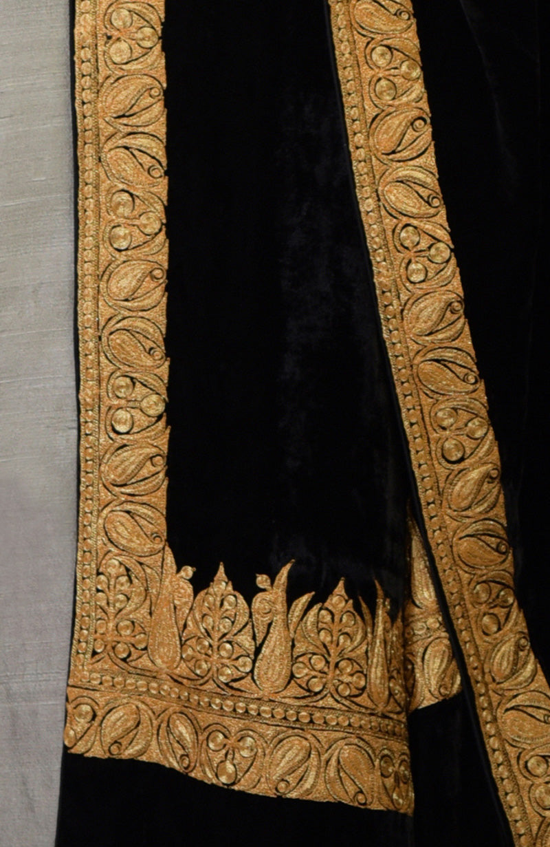 Close-up of a black Kashmiri Tilla embroidered dupatta with gold patterns.