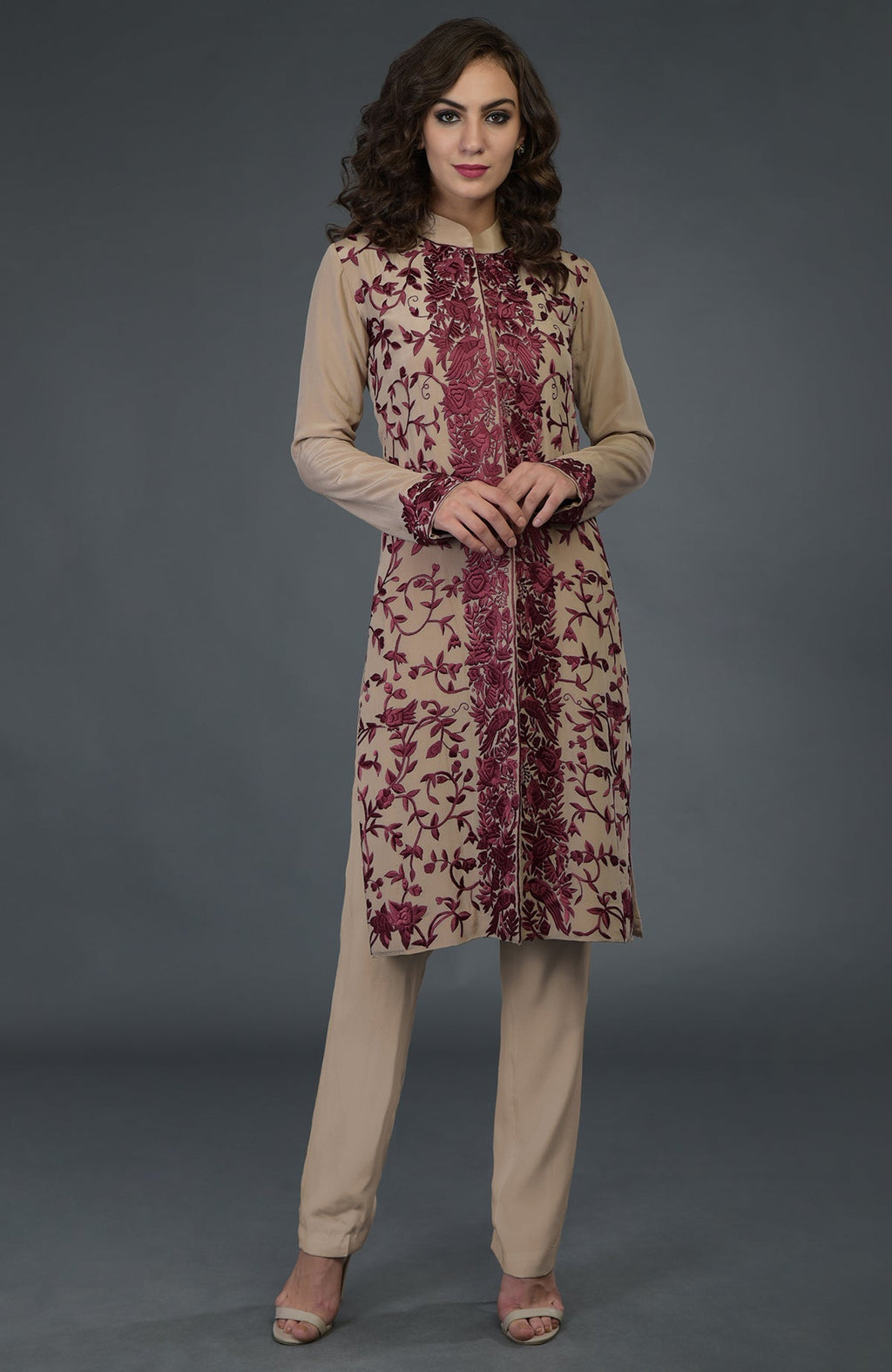 A fawn-wine Parsi Gara jacket set with intricate floral and bird embroidery.