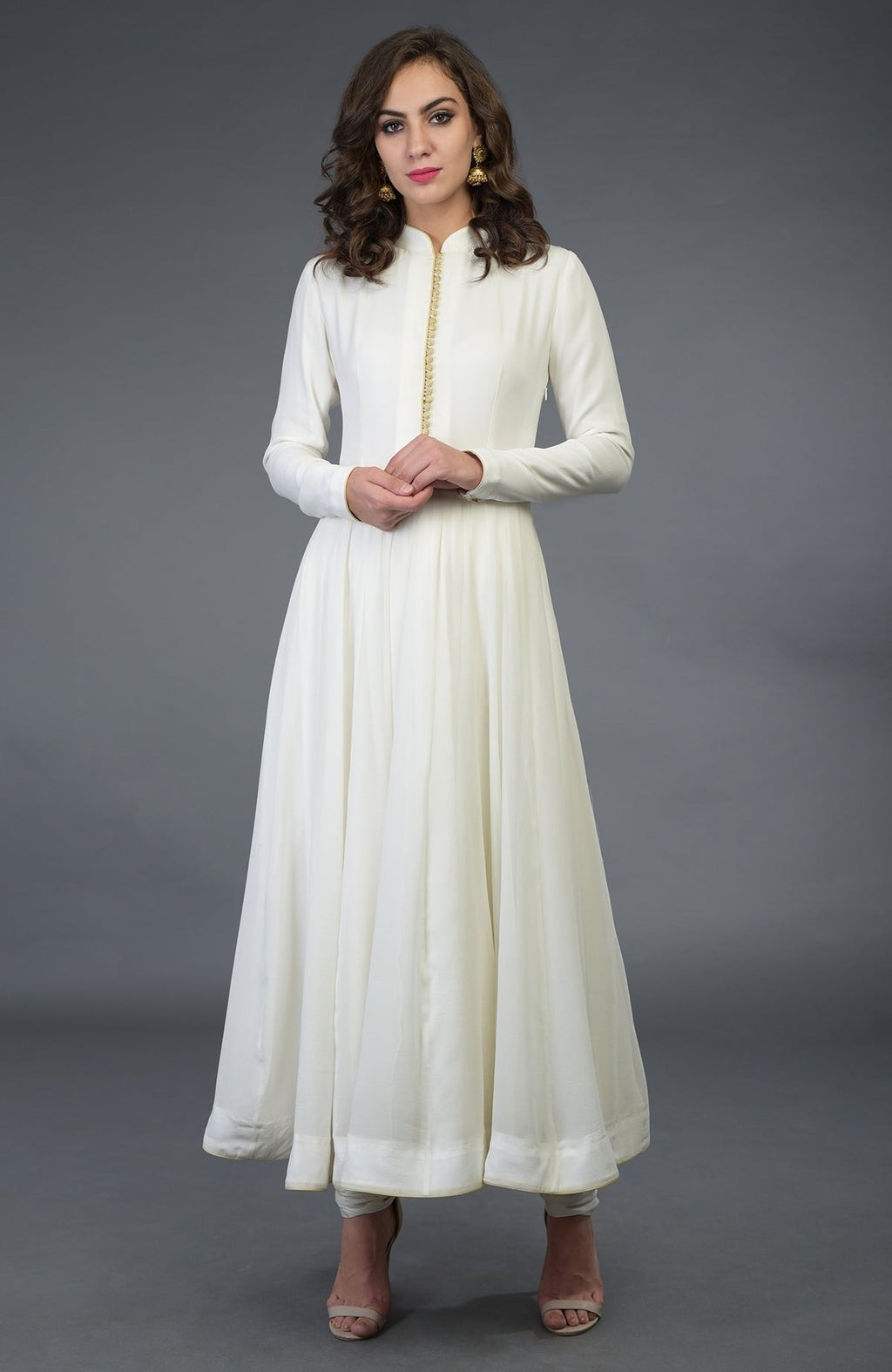 Anarkali suit in ivory with gold trim and matching churidar.