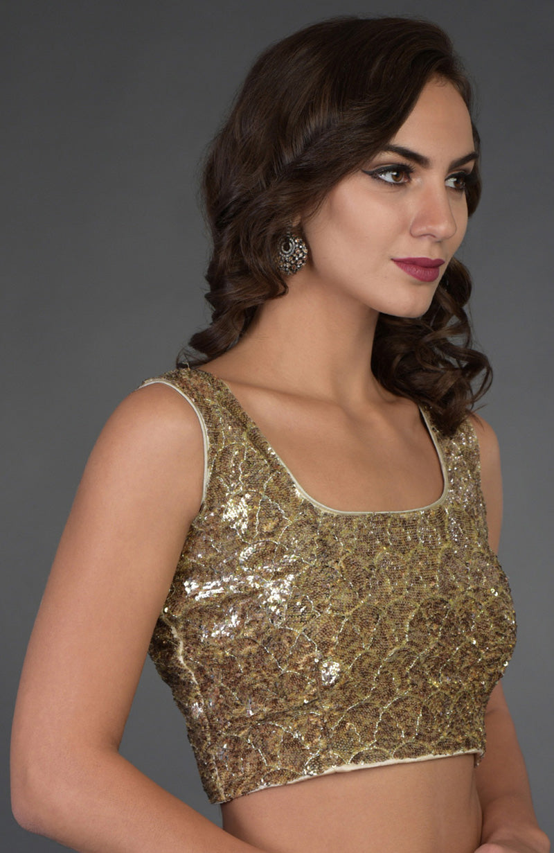 Gold sequin and zardozi hand-embroidered sleeveless blouse with a square neckline.