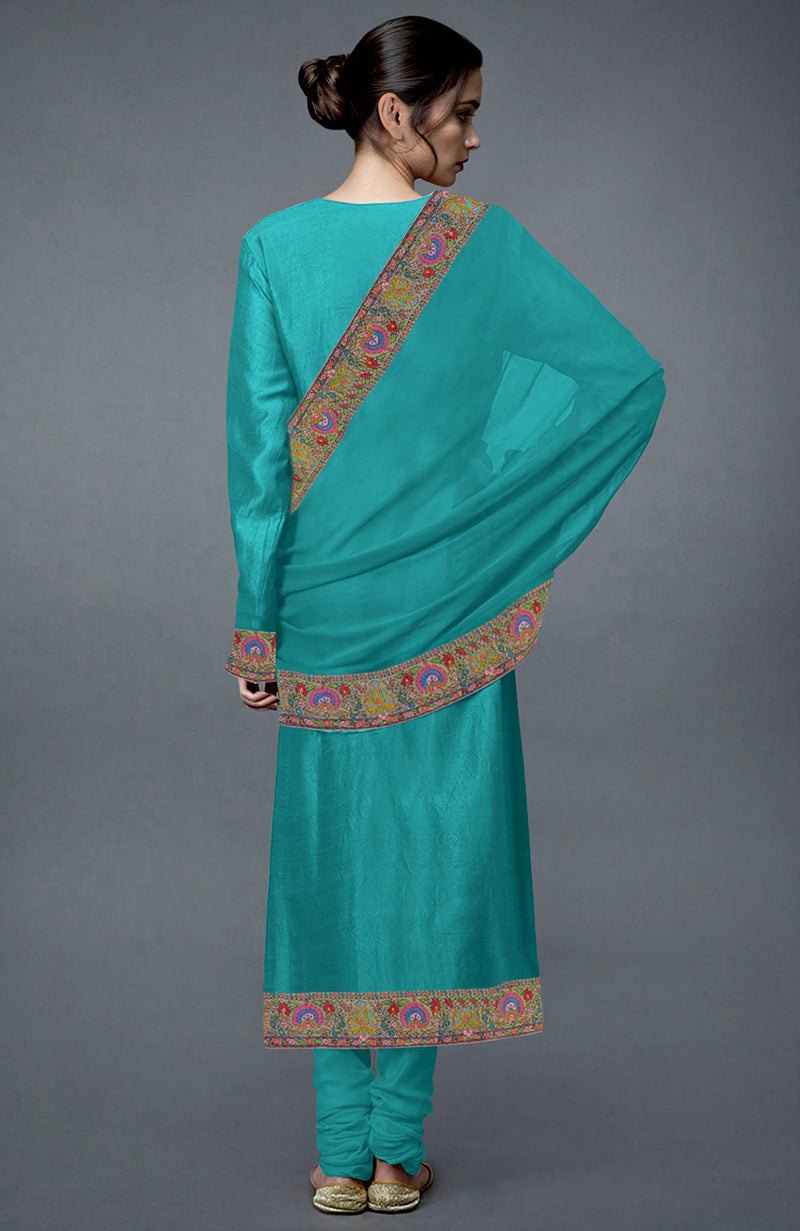 Viridian green raw silk suit with Kashmiri Kashidakari hand embroidery.