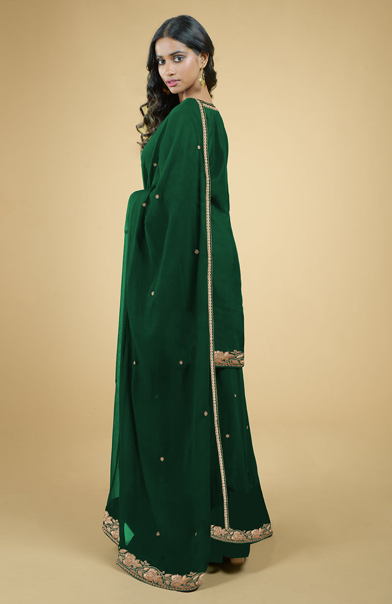 Emerald green sharara set with gold Kashmiri tilla embroidery.