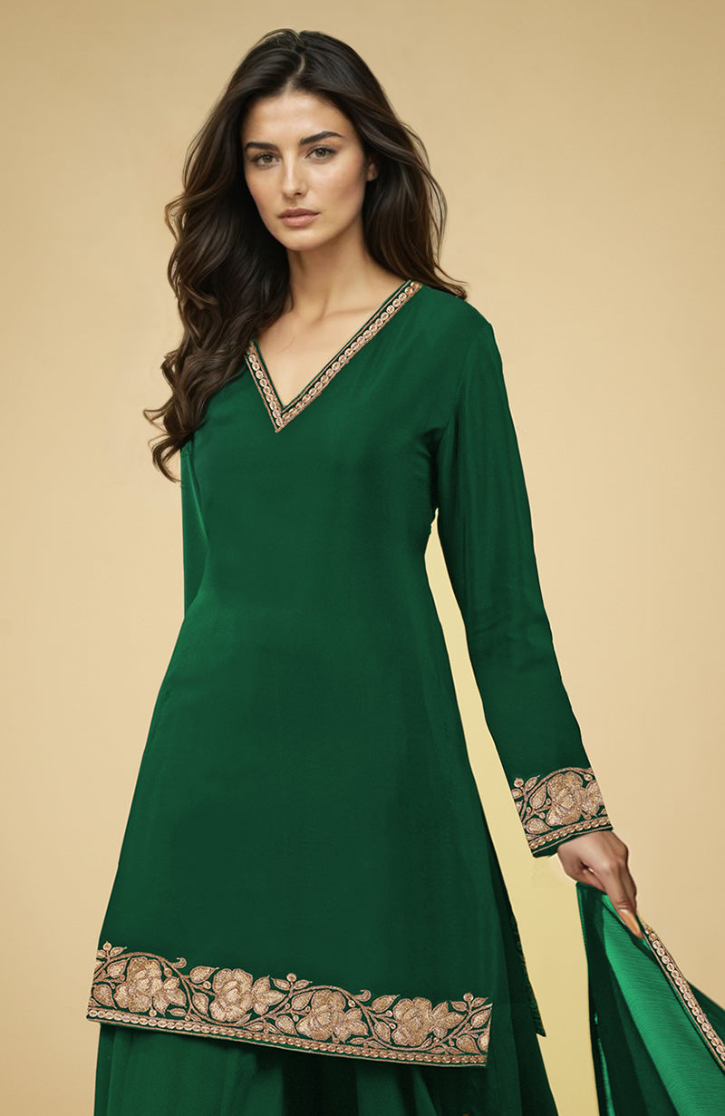 Emerald green sharara set with gold Kashmiri tilla embroidery.