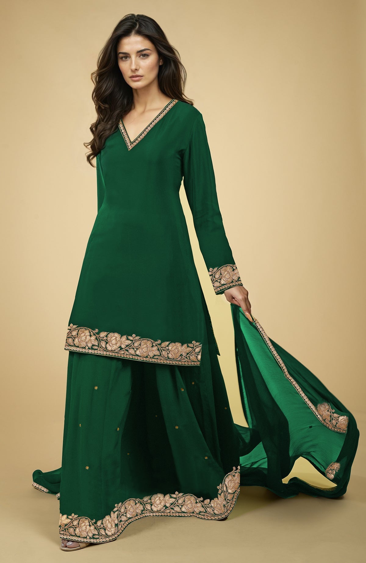 Emerald green sharara set with gold Kashmiri tilla embroidery.
