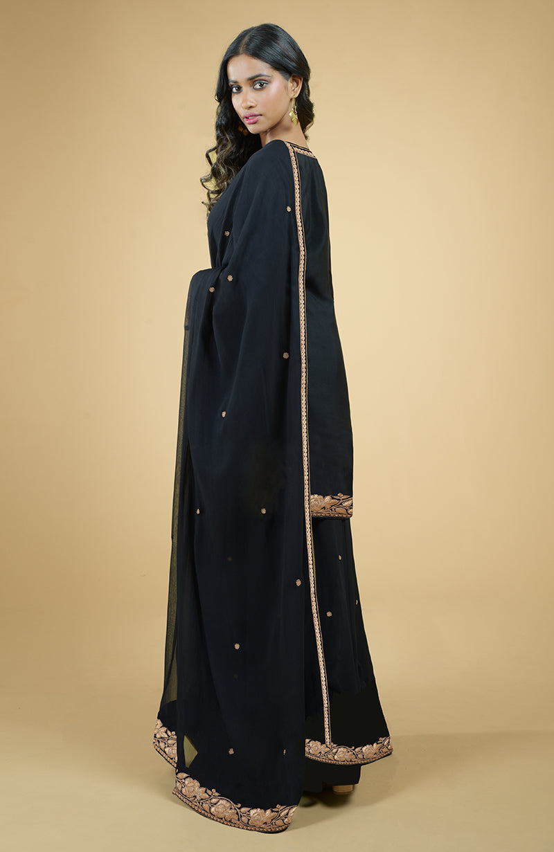 Black sharara set with gold Kashmiri tilla embroidery on kurta, sharara, and chiffon dupatta edges