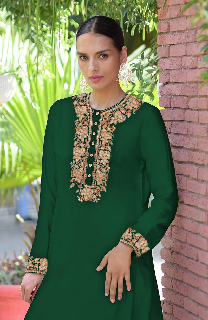 Emerald green Kashmiri tilla embroidered kurta set with intricate detailing.