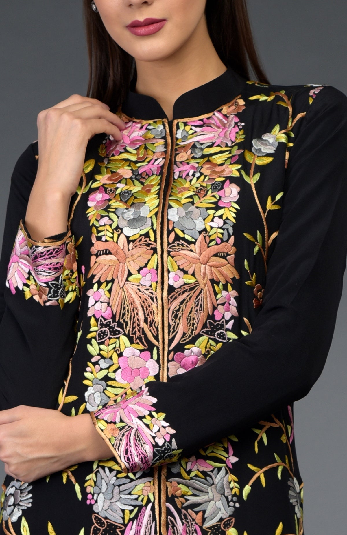 Black Parsi Gara embroidered jacket with colorful floral and bird patterns.