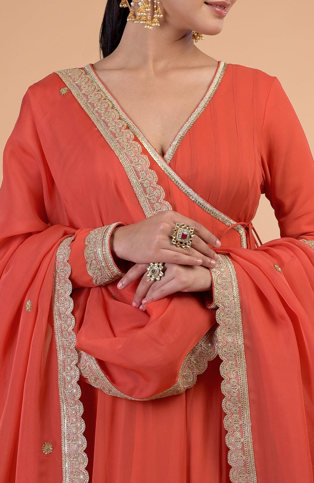 Burnt orange Angrakha Anarkali set with gold Gota Patti embroidery and matching dupatta.