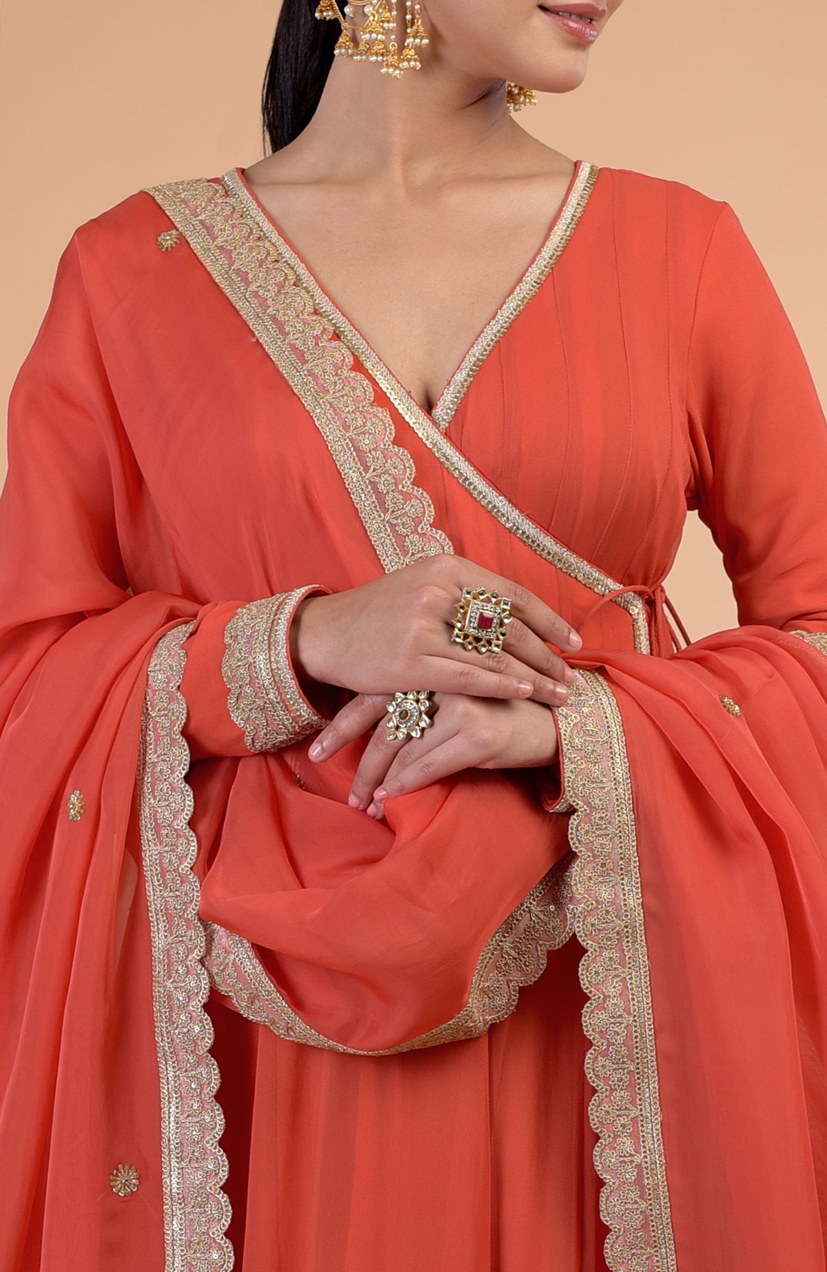 Burnt orange Angrakha Anarkali set with gold Gota Patti embroidery and matching dupatta.