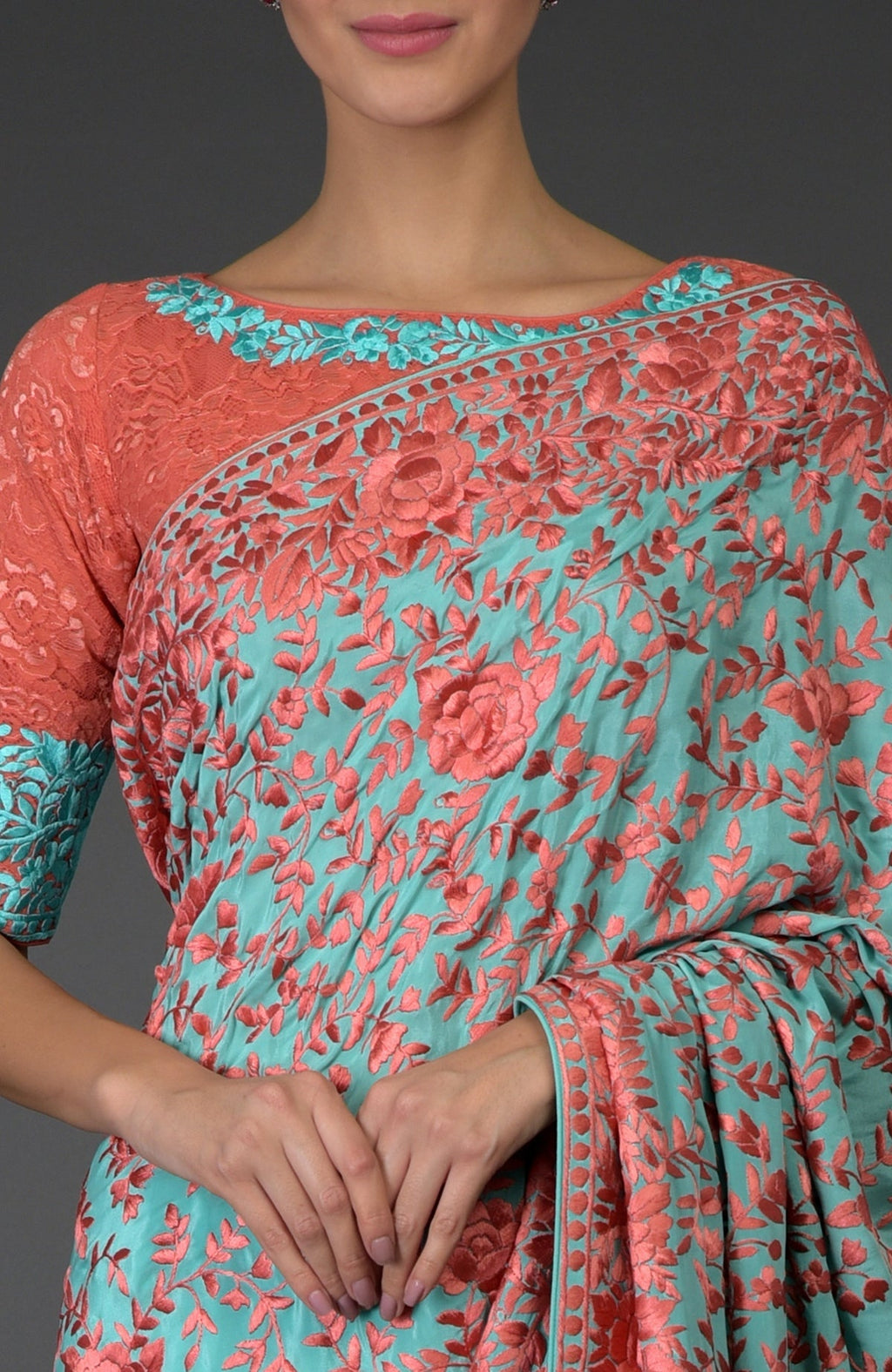 Aqua Parsi Gara hand embroidered saree with peach floral embroidery and lace blouse.