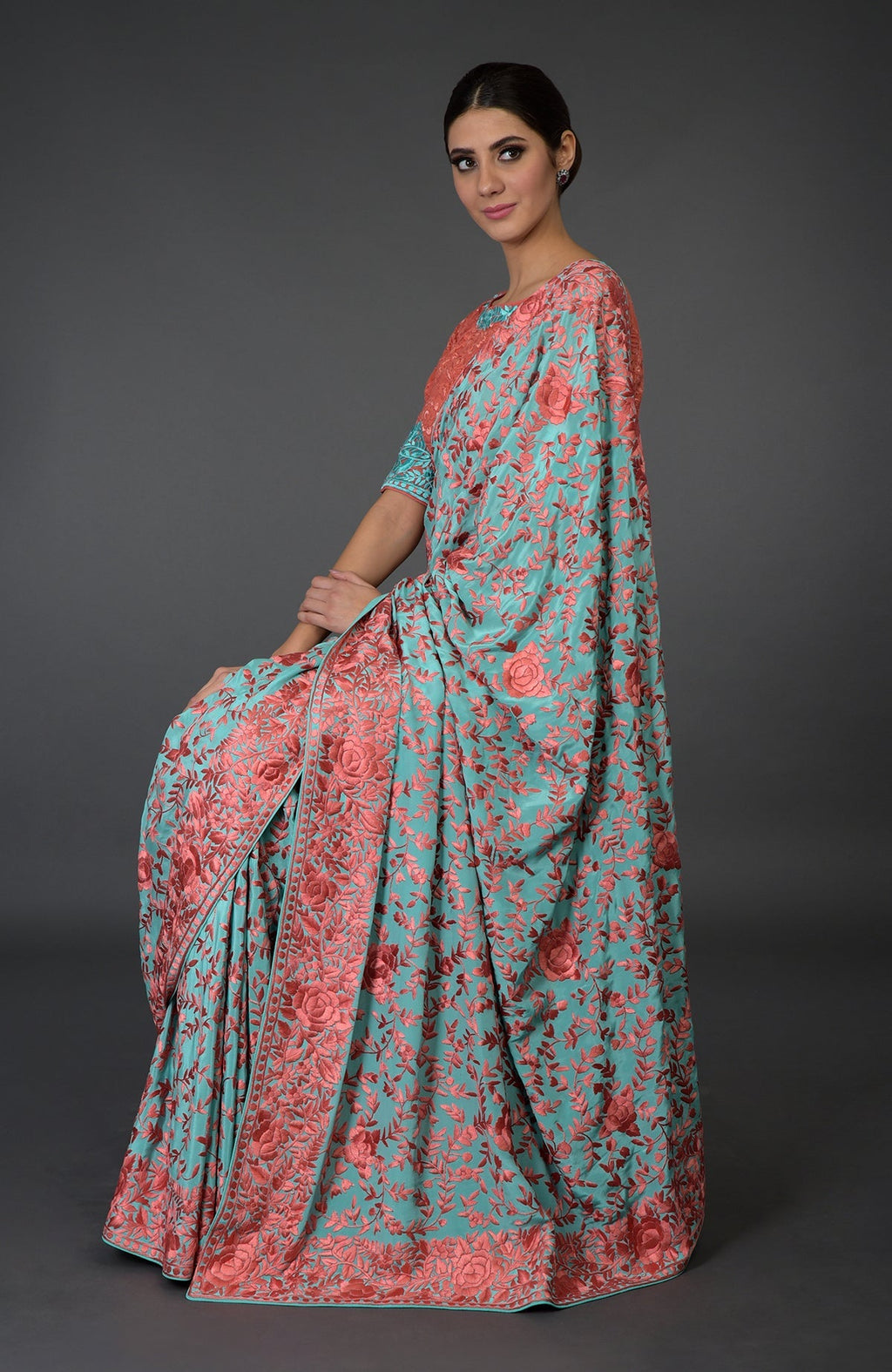 Aqua Parsi Gara hand-embroidered saree with peach floral patterns.