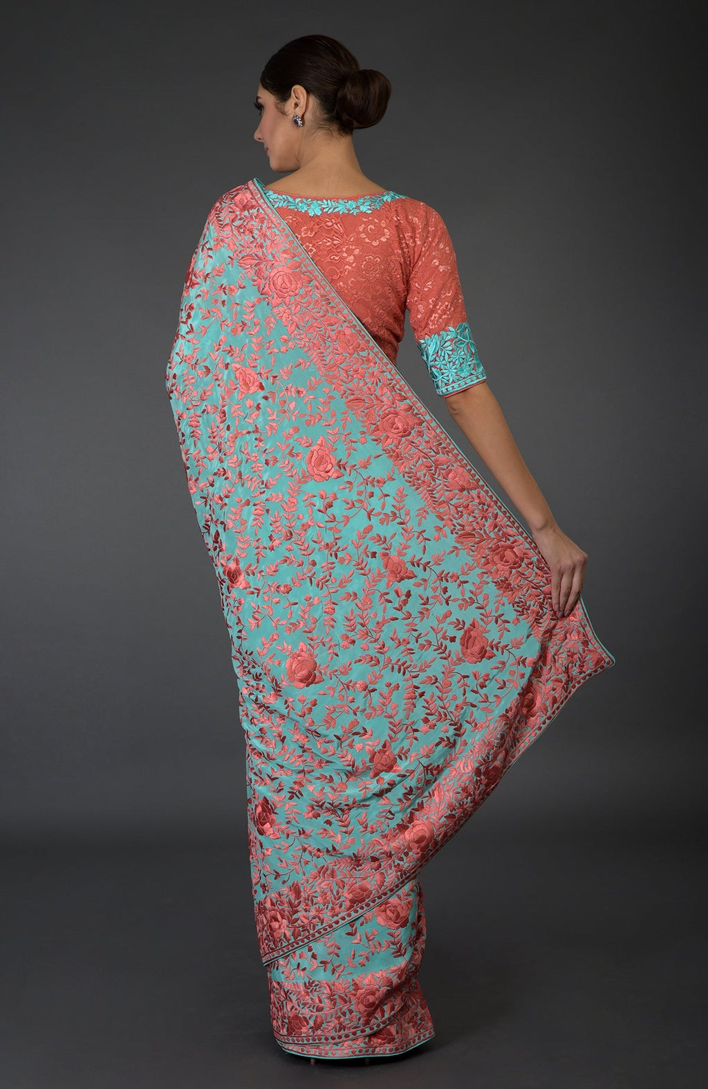 Aqua Parsi Gara hand-embroidered saree with peach floral patterns.