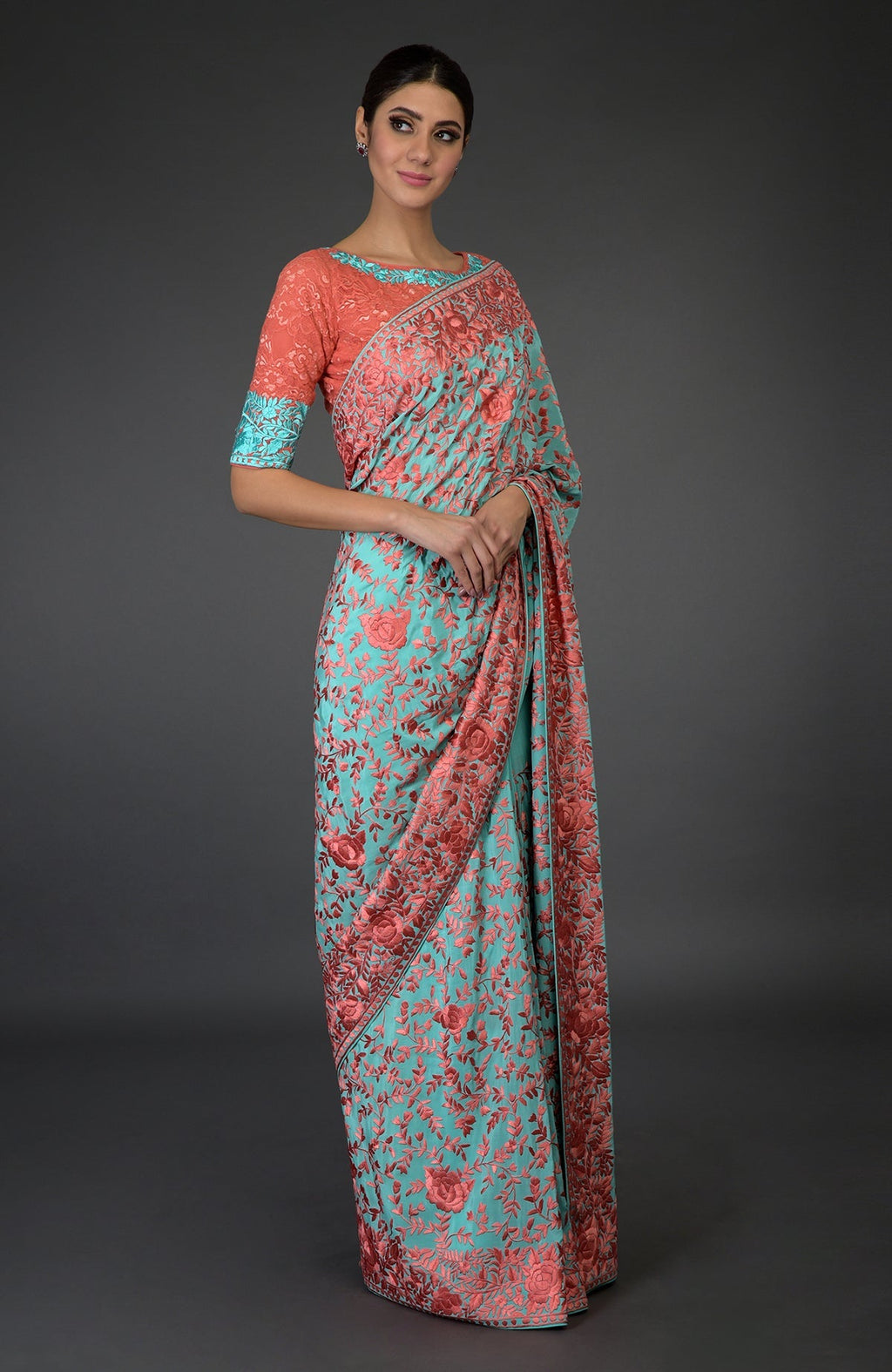 Aqua Parsi Gara hand-embroidered saree with peach floral patterns.