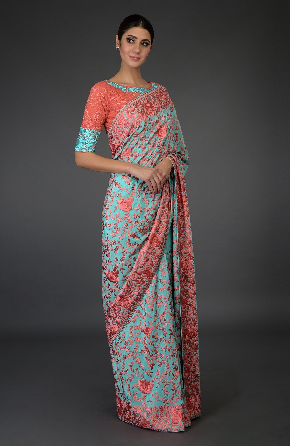 Aqua Parsi Gara hand-embroidered saree with peach floral patterns.