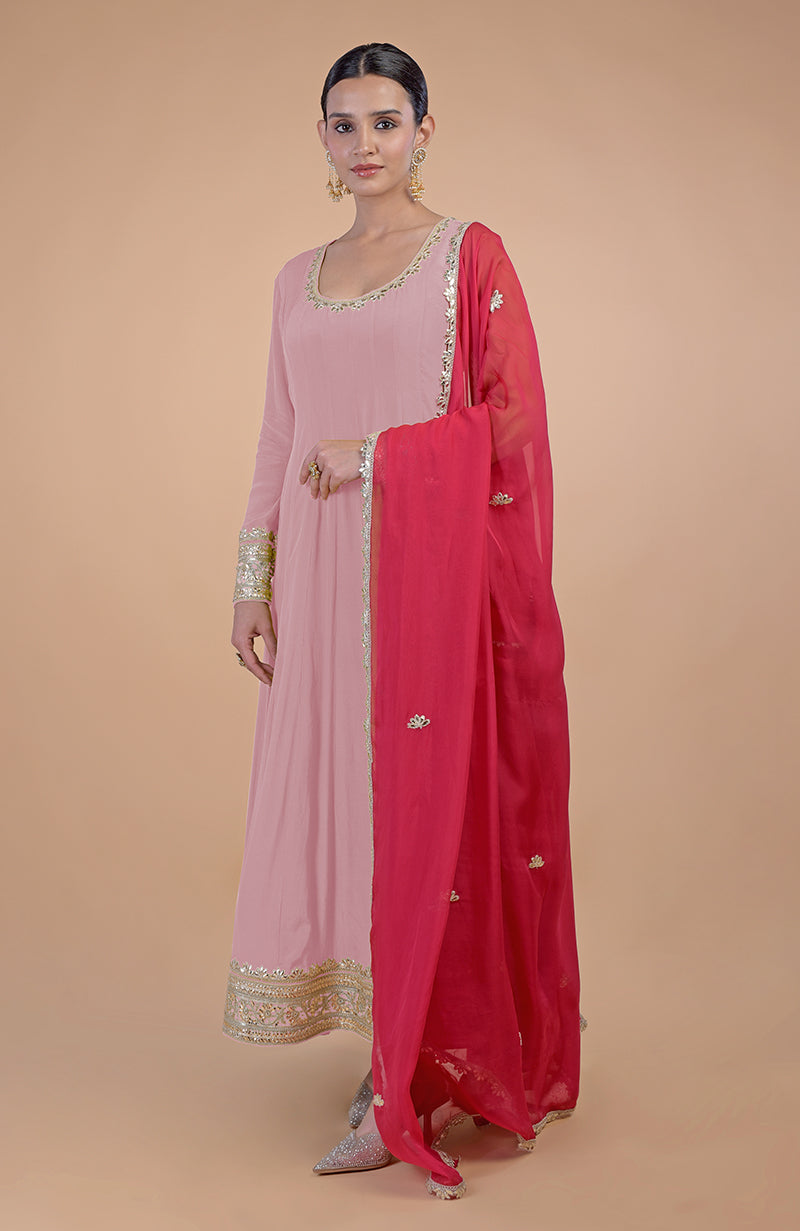 Pink Anarkali set with gold Gota Patti embroidery and a contrasting pink dupatta.