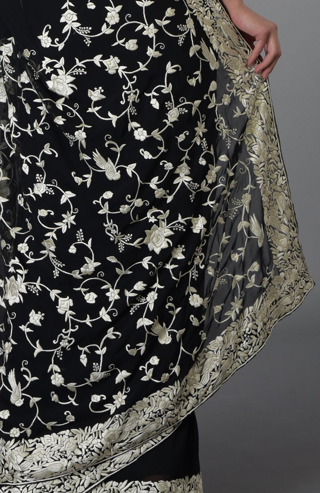 Black and ivory Parsi Gara hand-embroidered saree with floral and bird motifs.