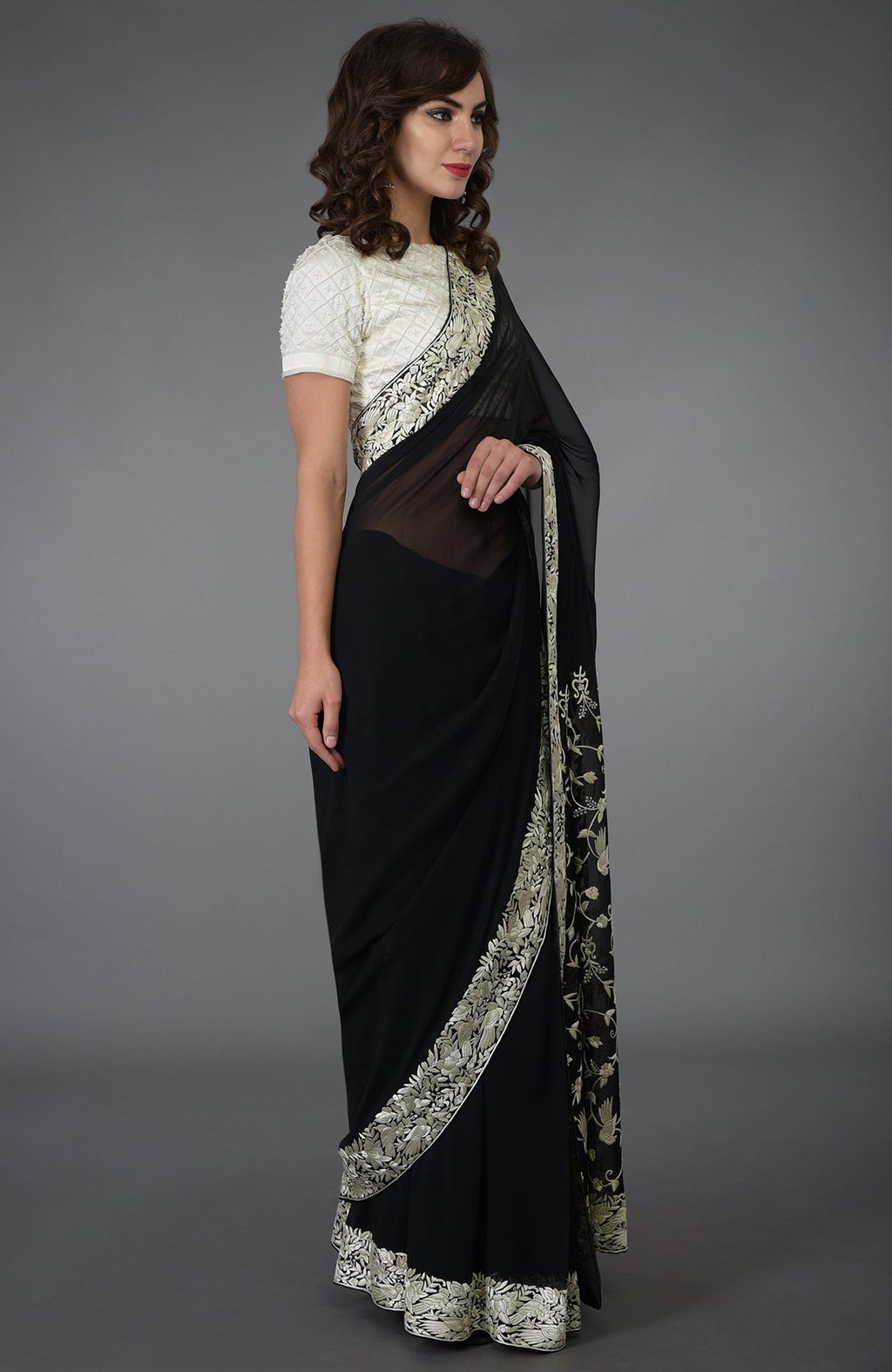 Black and ivory Parsi Gara hand-embroidered saree with floral and bird motifs.