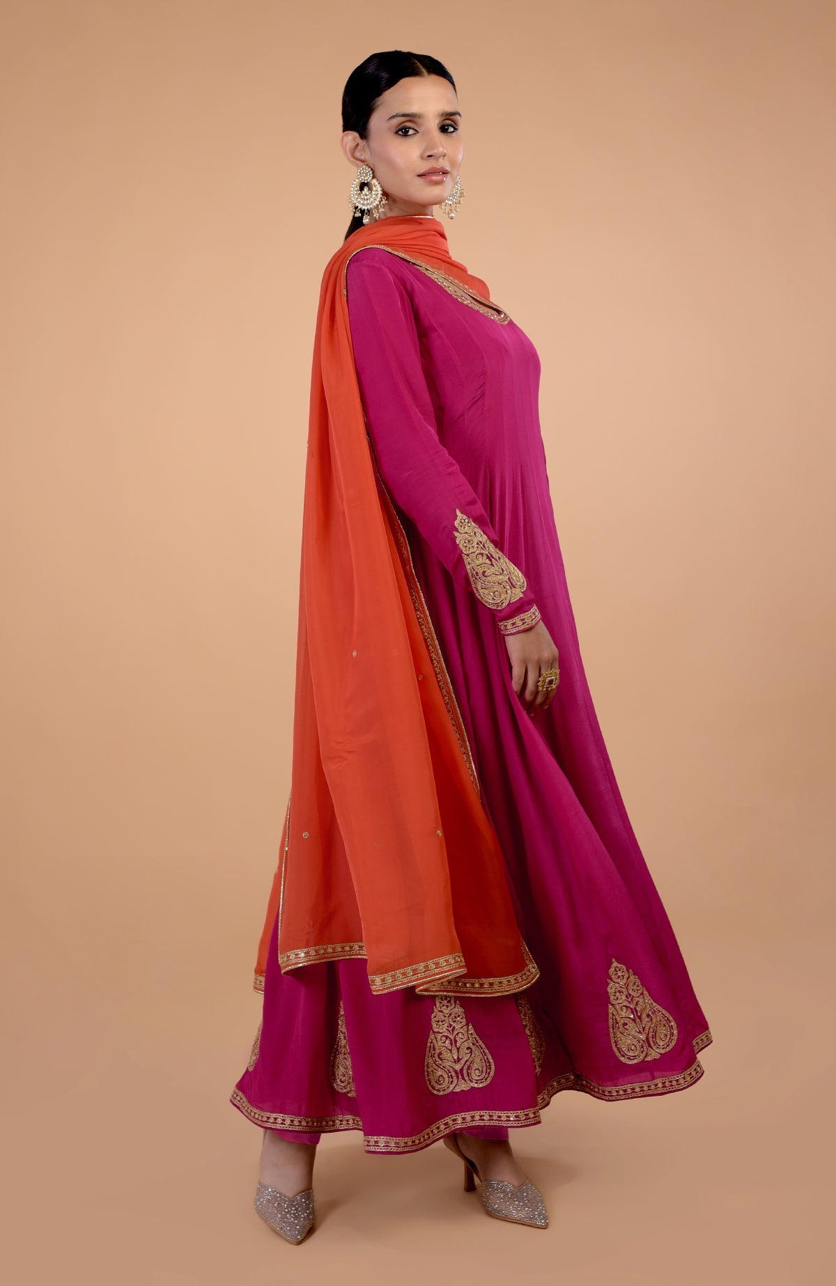 Raspberry pink Anarkali set with orange dupatta and gold Kashmiri Tilla embroidery.