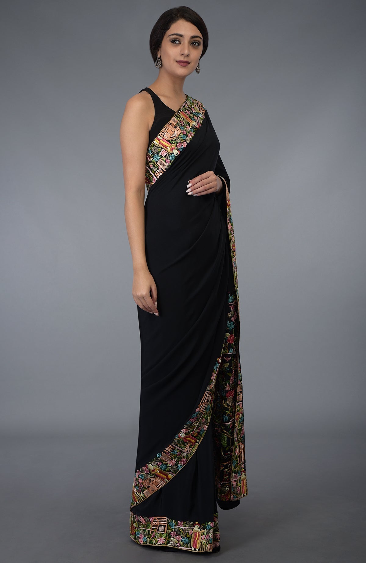 Black Parsi Gara hand embroidered saree with colorful floral and scenic borders.